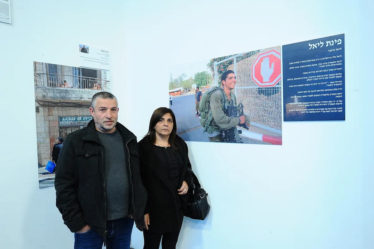 Guests in front of the works wall at the "Off the Rails" exhibition, 2016