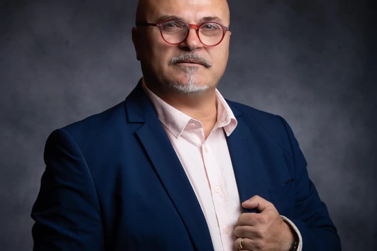 Studio portrait — blue blazer, light shirt and red glasses — headshots for dentists, Sharon Gabay