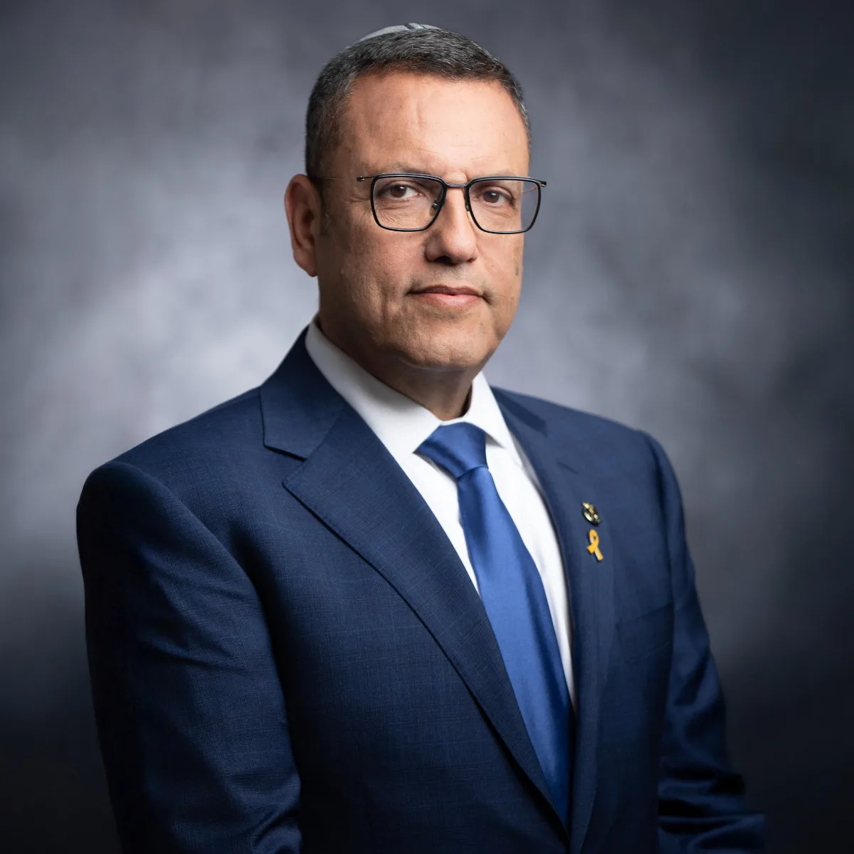 A polished business headshot of Jerusalem Mayor Moshe Lion, upright posture and a direct gaze projecting authority — Sharon Gabay, headshot photographer