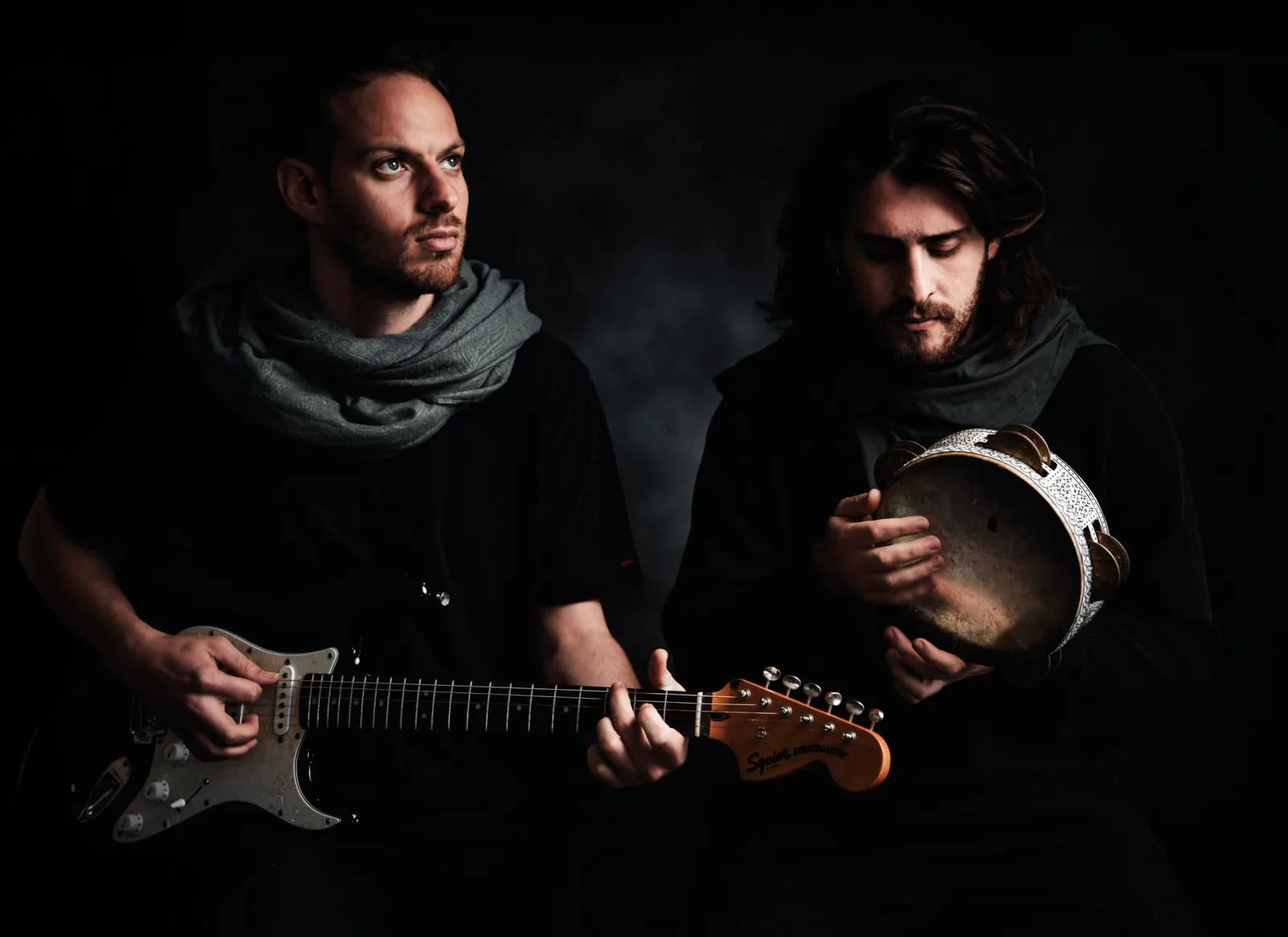 Headshot of a musical ensemble with a guitar and a frame drum in atmospheric lighting — Sharon Gabay, headshot photographer