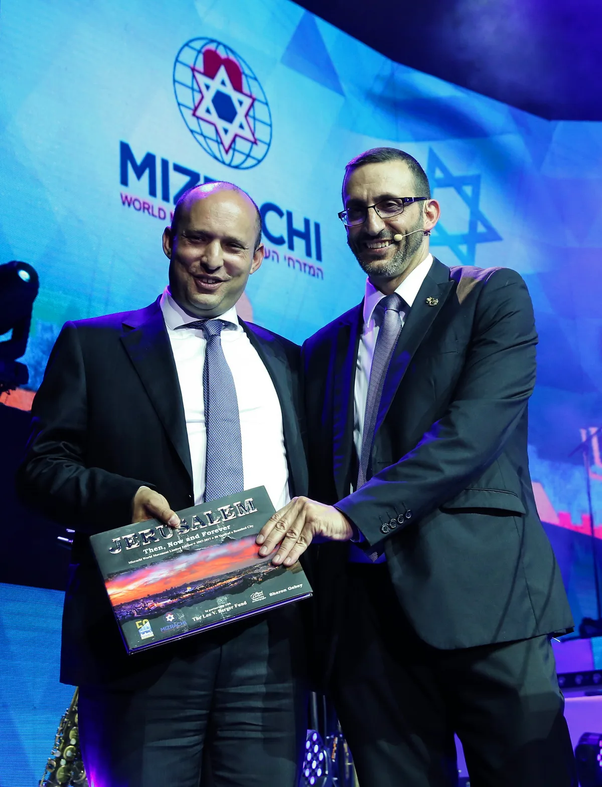 Former Prime Minister Naftali Bennett and Rabbi Doron Perez with Sharon Gabay's previous book