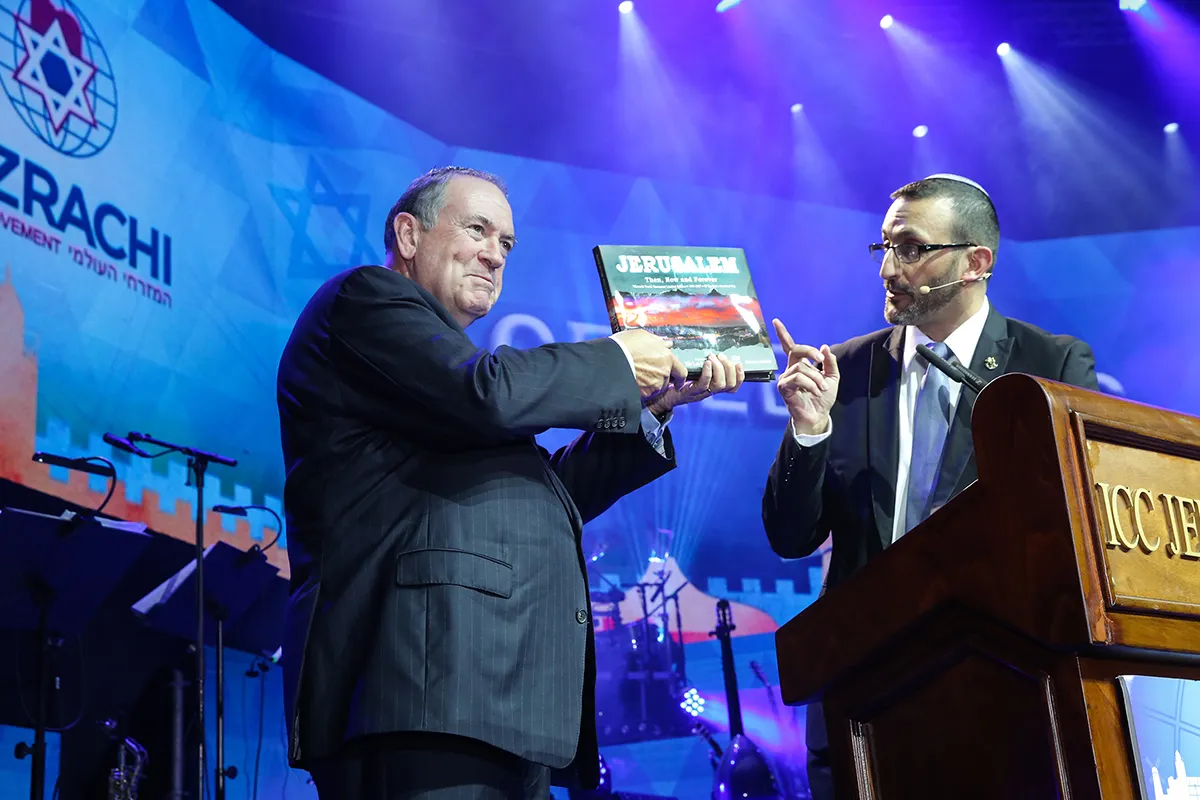 Ambassador Mike Huckabee with an earlier book by Sharon Gabay