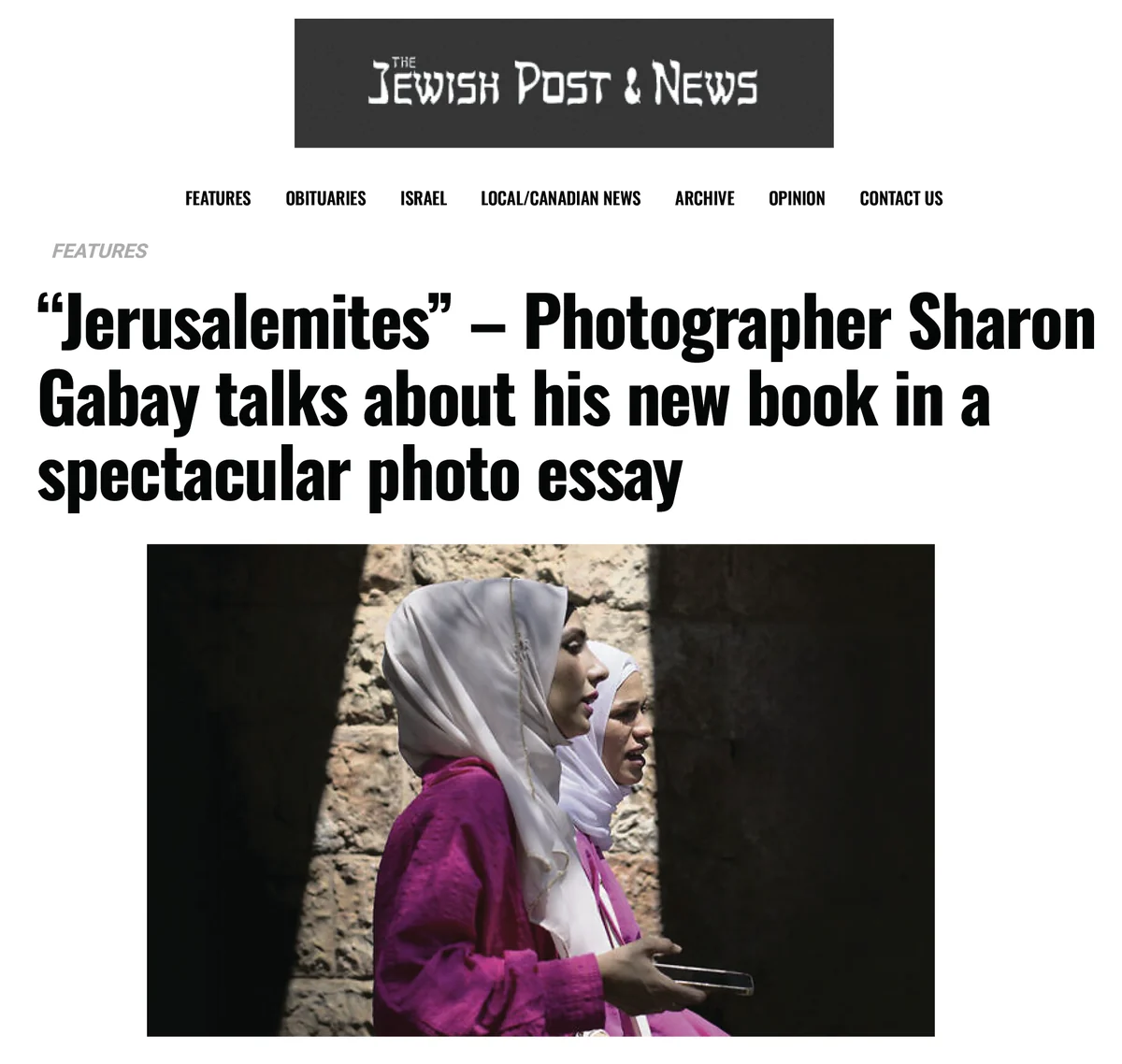 The opening of the feature on the photography book "Jerusalemites" in The Jewish Post & News, carrying the photograph of two women in the Old City of Jerusalem