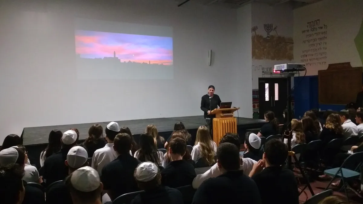 Sharon Gabay lecturing on Jerusalem at a Jewish school in Montreal alongside the exhibition, 2017