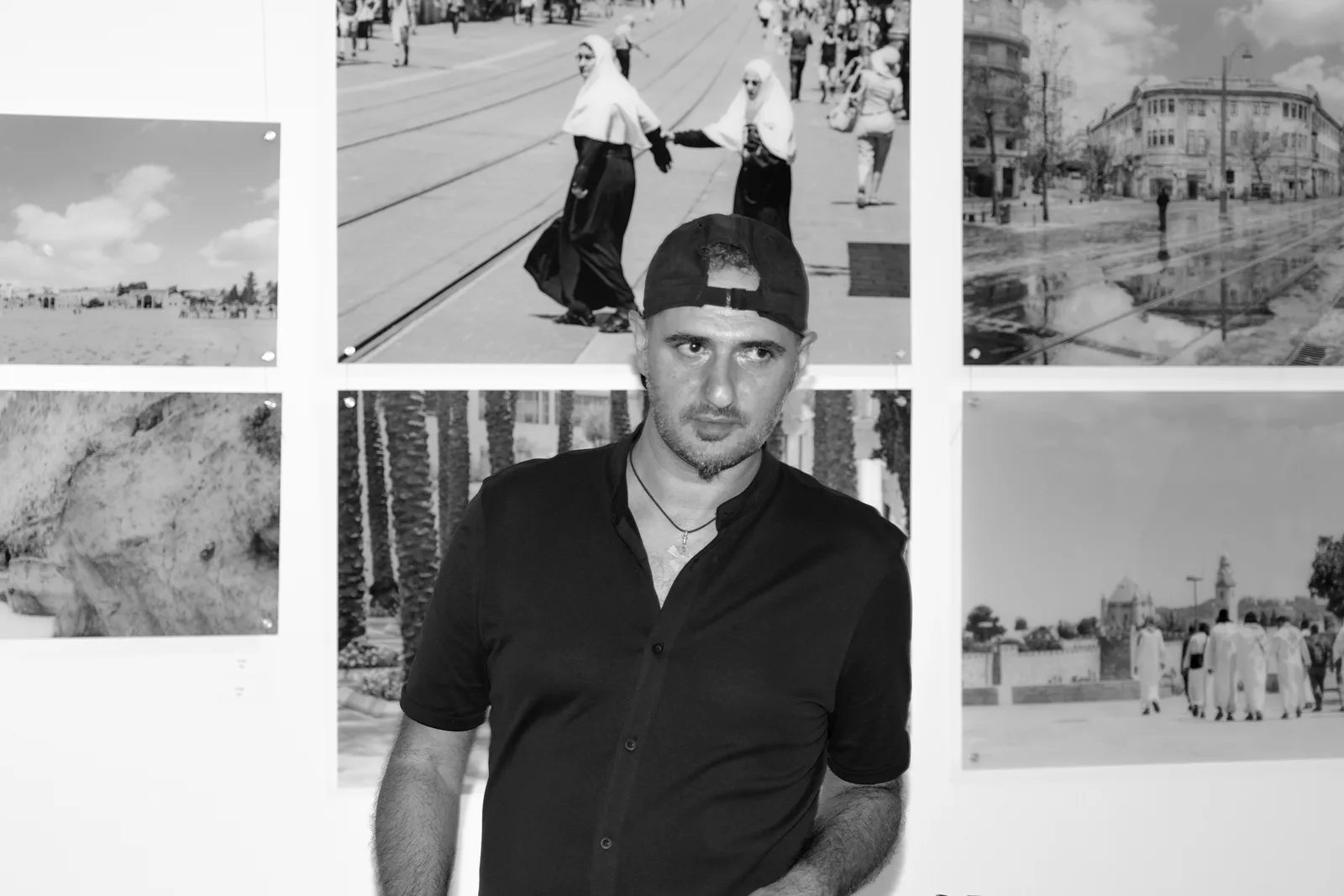Sharon Gabay in front of his photographs at the Jerusalem Now and Forever exhibition, Goldman Gallery, Bender JCC, Rockville, Maryland, 2017