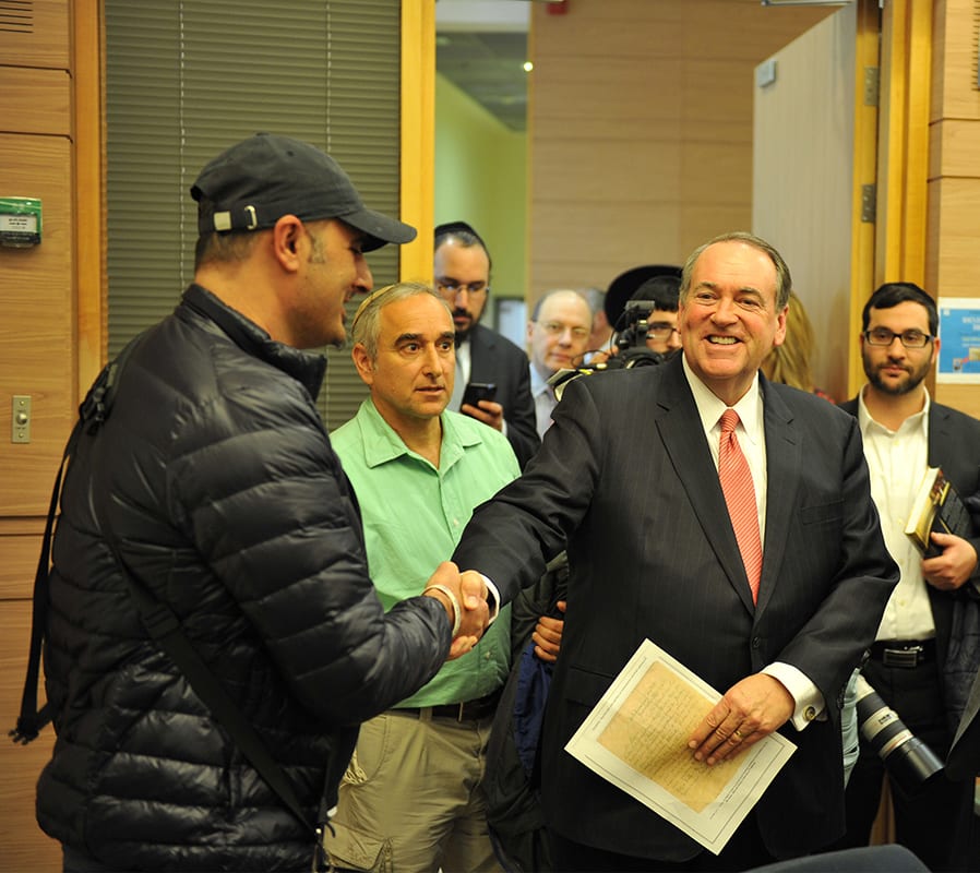 Ambassador Mike Huckabee with an earlier book by Sharon Gabay