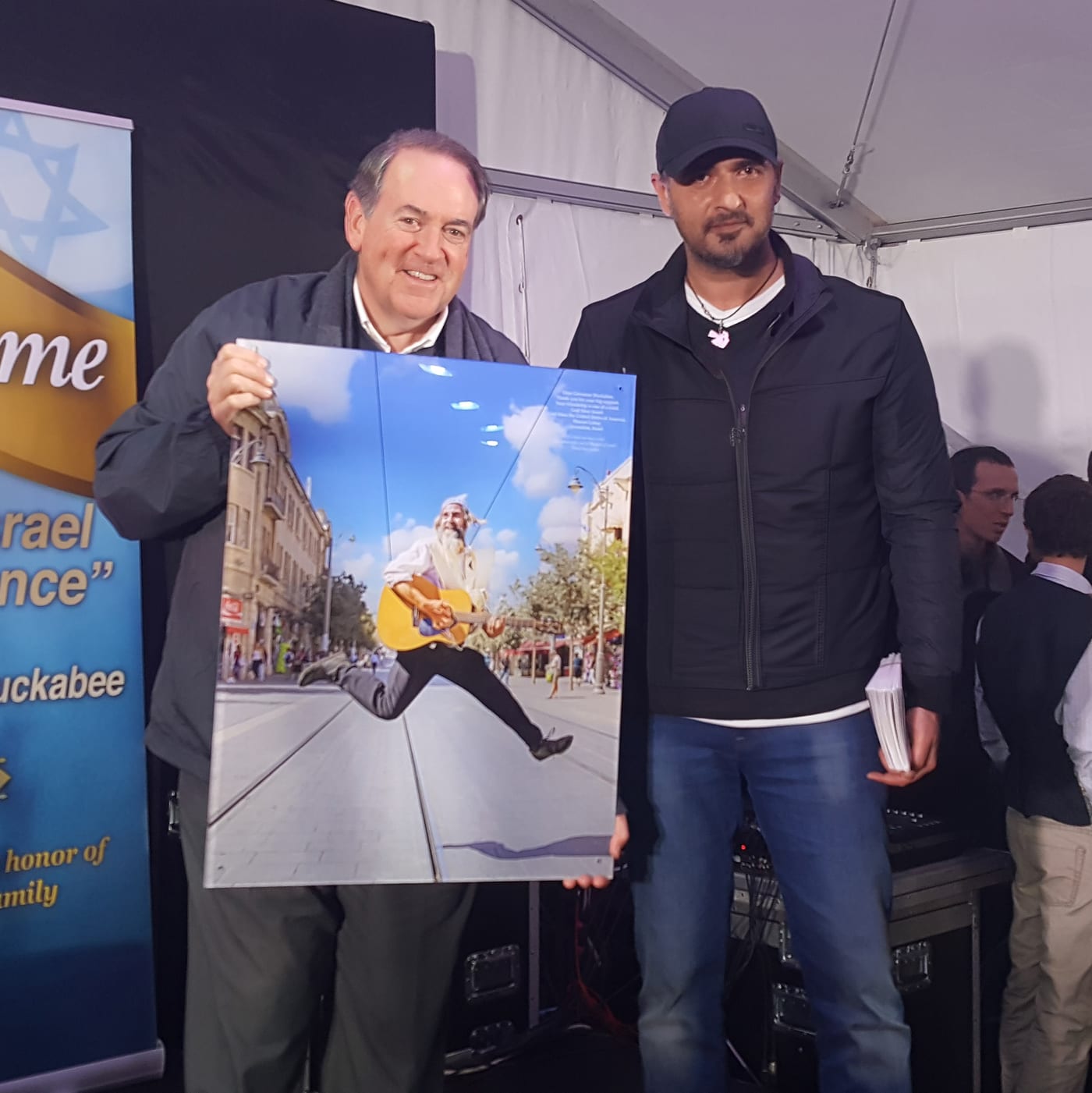 Ambassador Mike Huckabee with an earlier book by Sharon Gabay